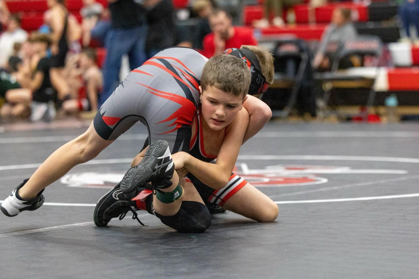 Earlham youth wrestler working a takedown