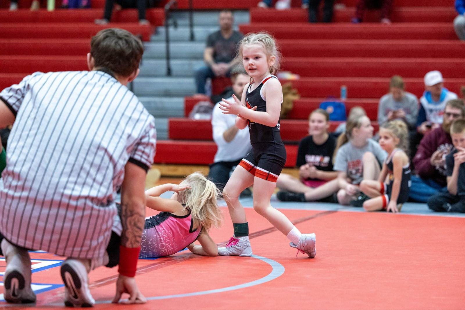 Young Earlham wrestler celebrating a win