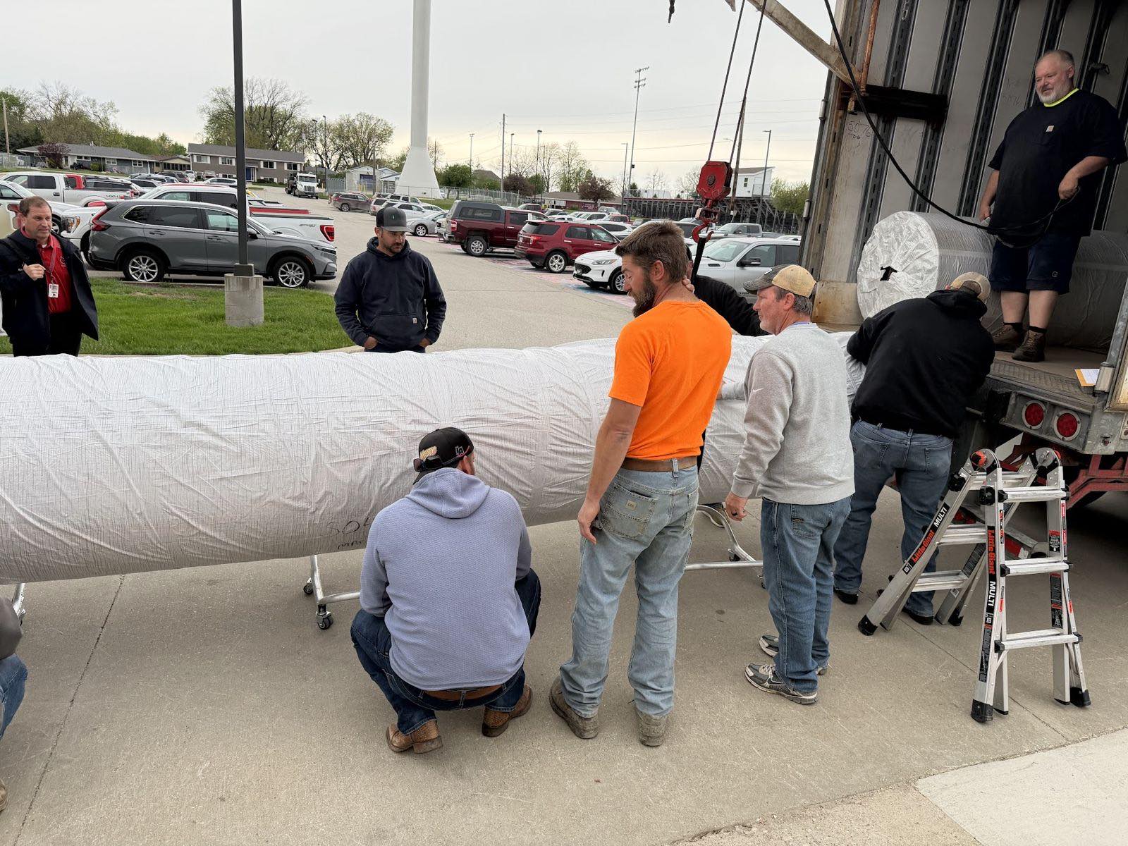 Volunteers unloading the new mats