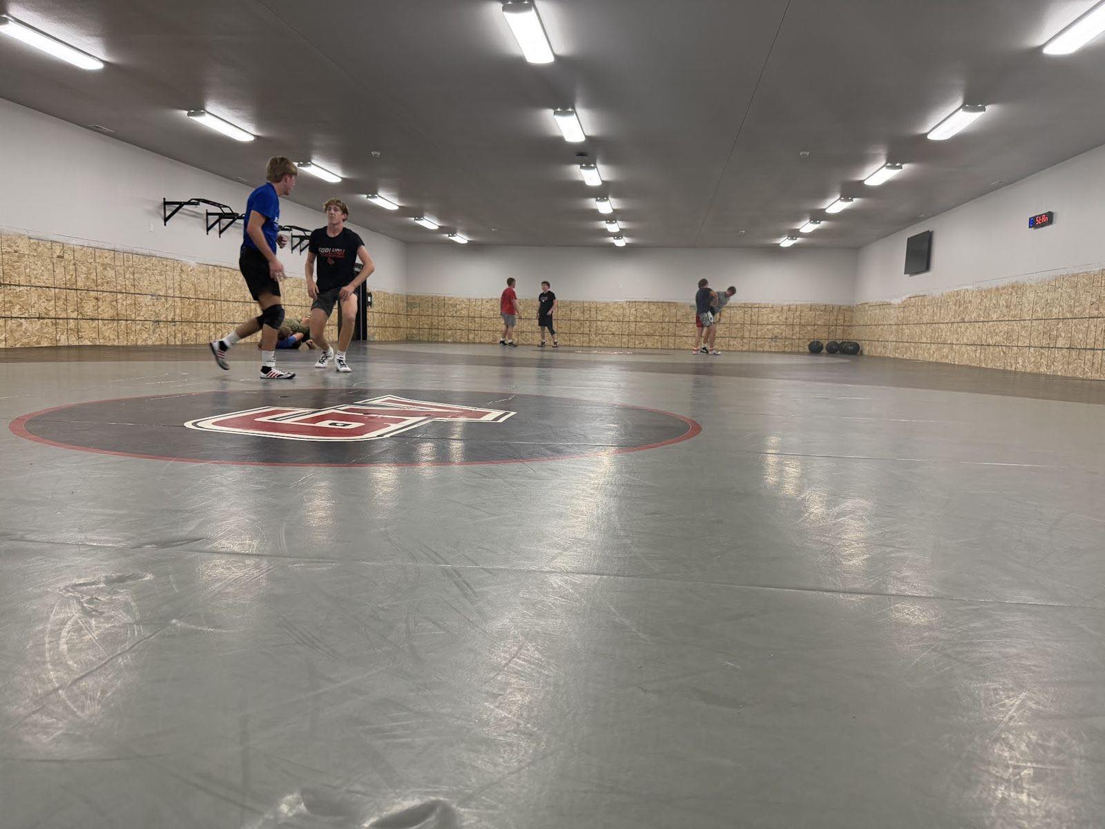 Wrestlers practicing in the new room